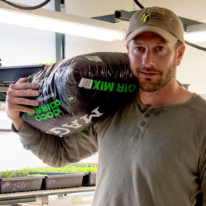 Harlan Blynn holding bag of mix