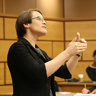 Christine Bader, delivering lecture at Johnson