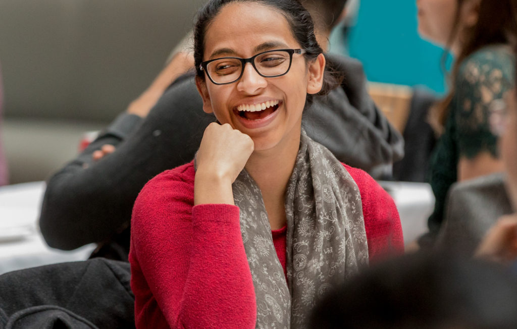 woman with glasses smiling Samuel Curtis Johnson Graduate School of Management