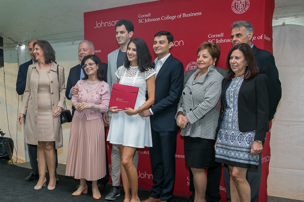 Guests and students pose for a photo