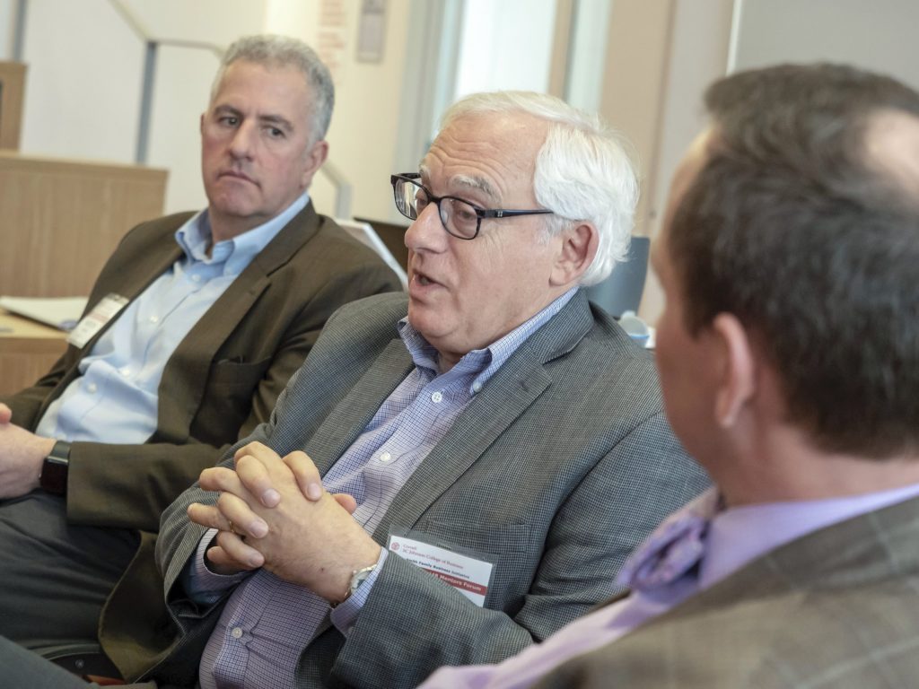 Three men talking