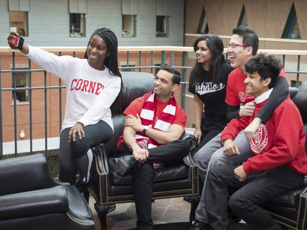 Cornell Johnson students taking a selfie.