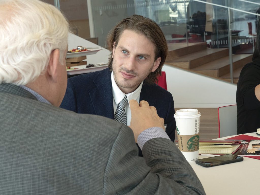 A student listens to his mentor's commentary