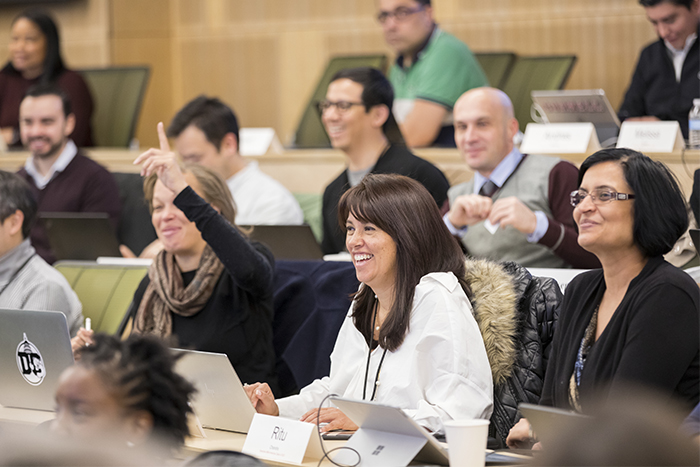 Students laughing in a lecture hall
