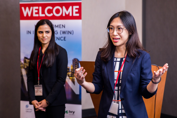 Students present a stock pitch at WIN conference