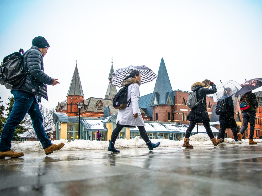 Students walking in front of Sage Hall.