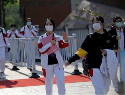 Students in China return to school after restrictions are lifted.
