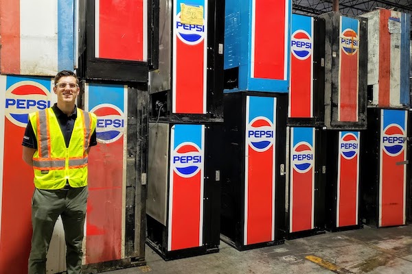 Taylor stands in front of old PepsiCo equipment