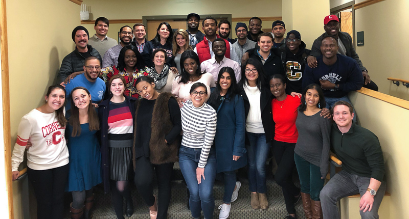 A large group of students poses for a photo