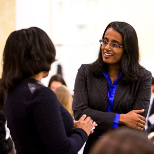 Lakshmi and a student talking