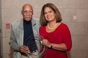 Wilbur and Angela stand with the award