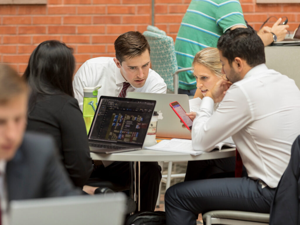 Students sitting around a table working together
