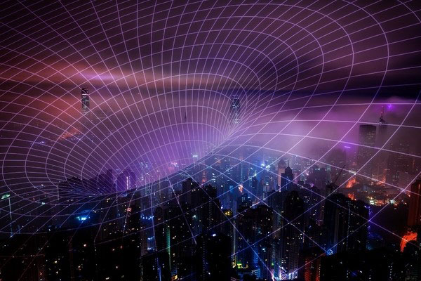 a funnel grid suggesting interconnectivity is superimposed over a city nighttime landscape