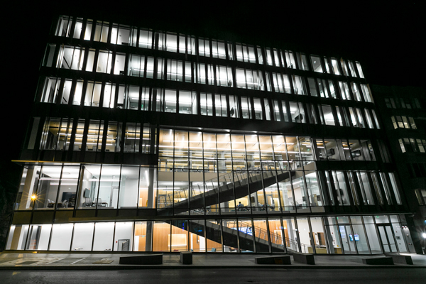 An exterior photo of Breazzano lit up at night