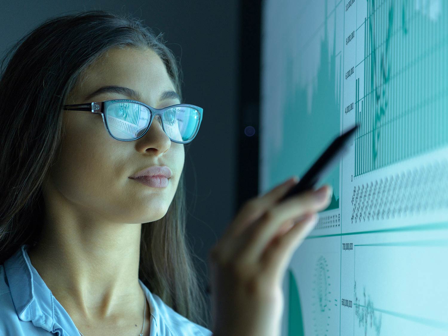 Woman pointing at charts