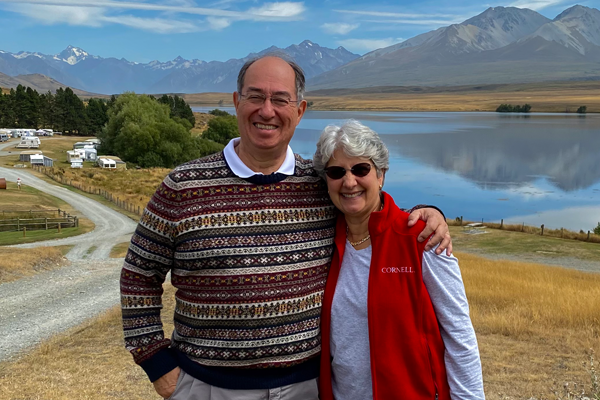 Gail and Roberto Cañizares ’71, MBA ’74 in front of a mountain range