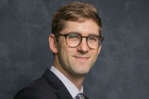 Headshot of Todd D. Gerarden in front of a backdrop