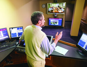 Professor teaching in EMBA Americas boardroom