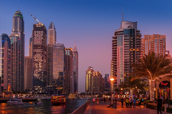City buildings on either side of a main street in Dubai.
