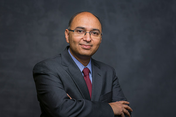 upper body photo of Vishal Gaur in a business suit and tie.