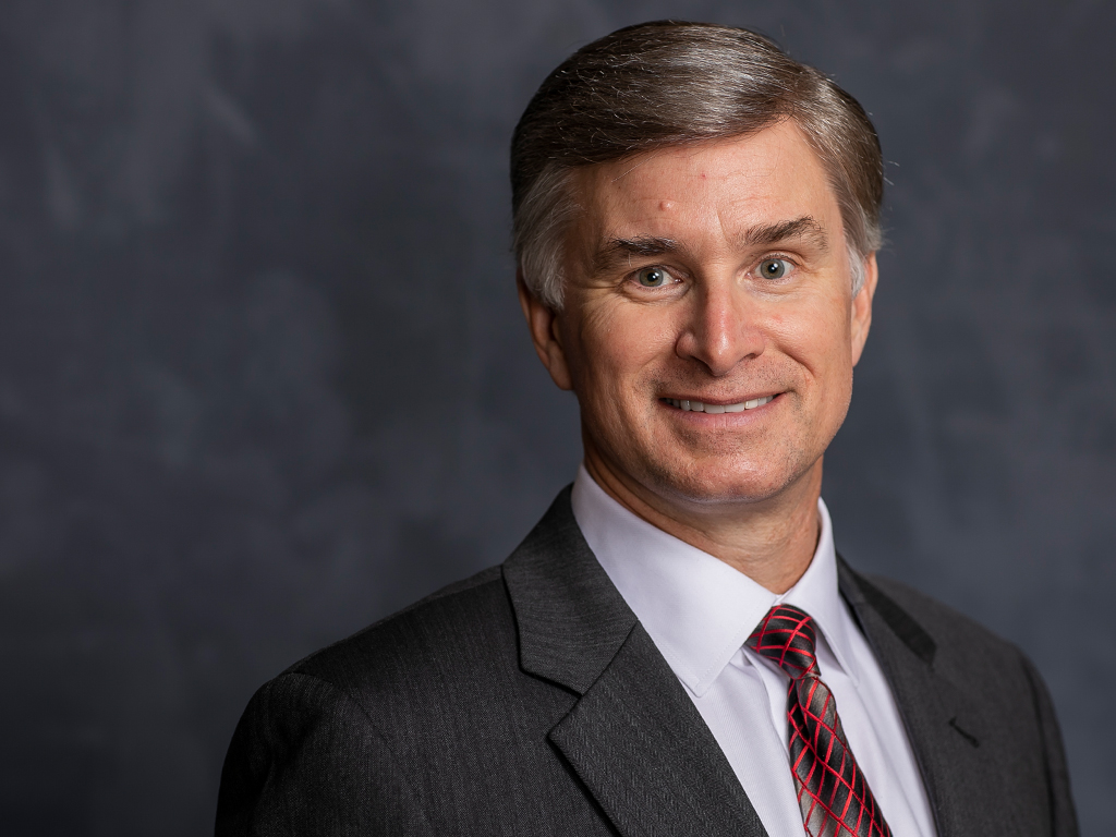 Headshot of Professor Eric Lewis.