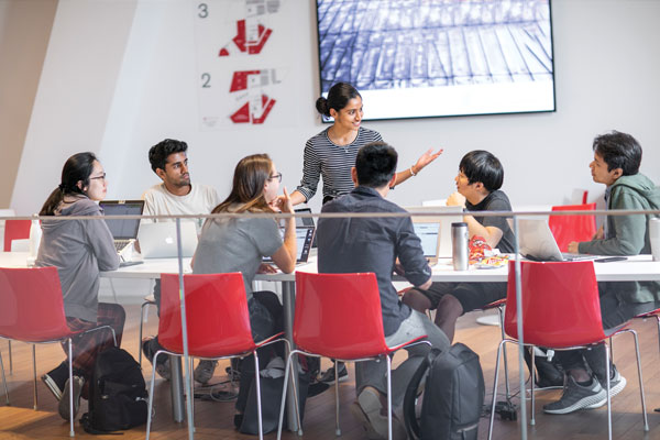 People sit around a conference table.