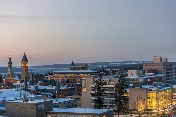 Aerial view of Cornell’s Ithaca, NY campus at dusk with a light snow covering.