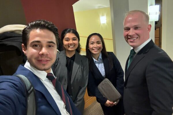 four students in business attire