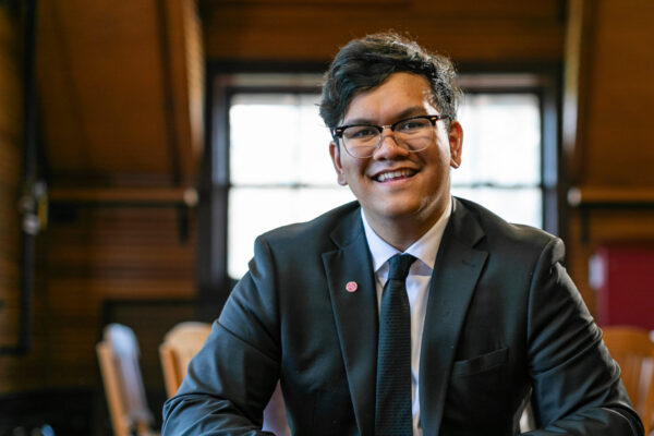 A male student smiling at the camera.