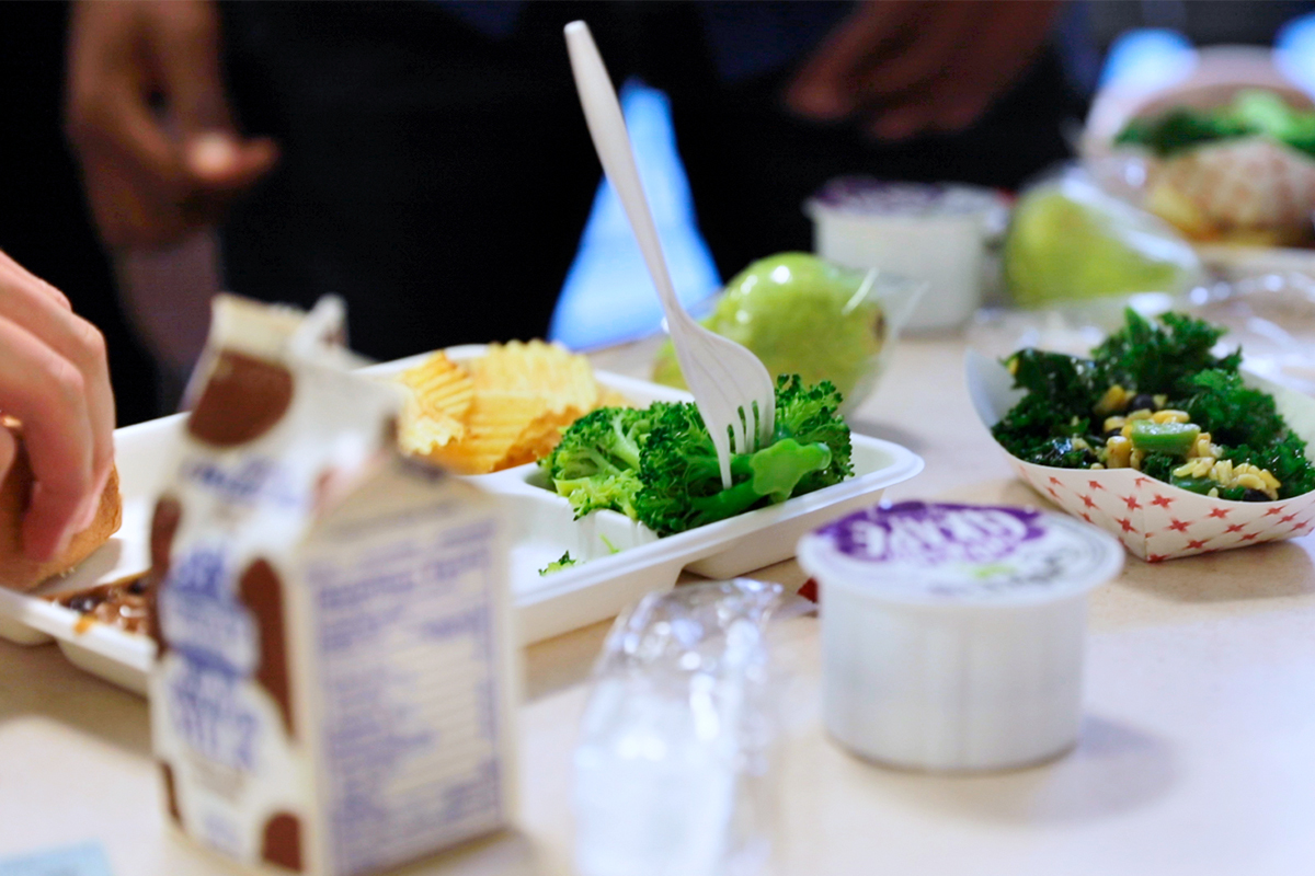 Image of students at City Honors School in Buffalo, New York, eat lunch on a “New York Thursday,” a weekly effort to promote the foods in the lunches that are grown or produced in New York State.