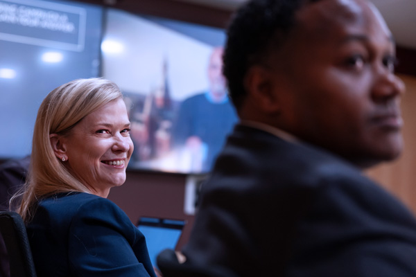 two students in EMBA Americas boardroom