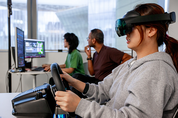 A student in the lab wearing VR headset.