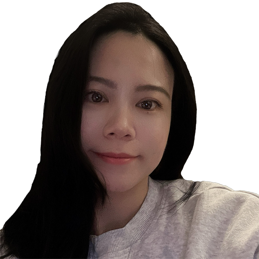 woman in gray sweatshirt slightly smiling toward viewer