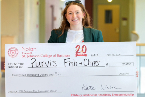 Avery Sheppard holds her first place $25,000 prize.