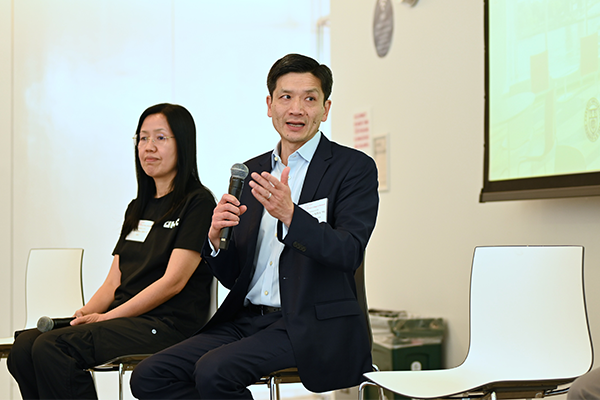 Two people present at an AI conference at Cornell Tech